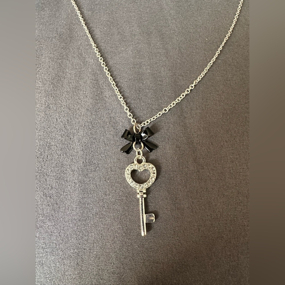 Heart key necklace with black bow. Sliver chain included.